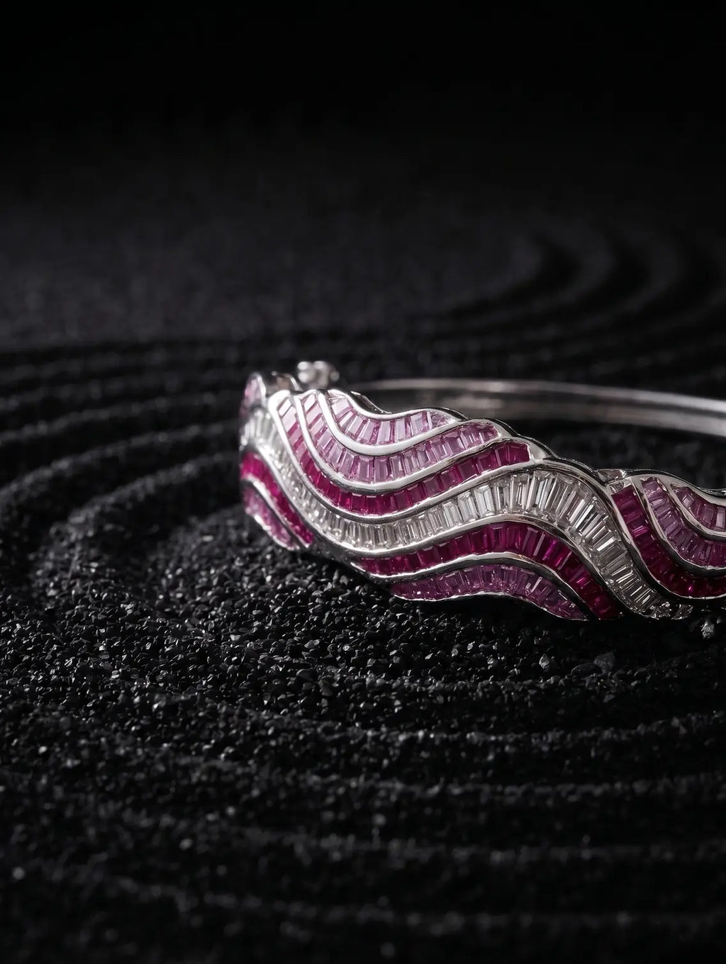 Ridged detail in silver bracelet wave inspired structure