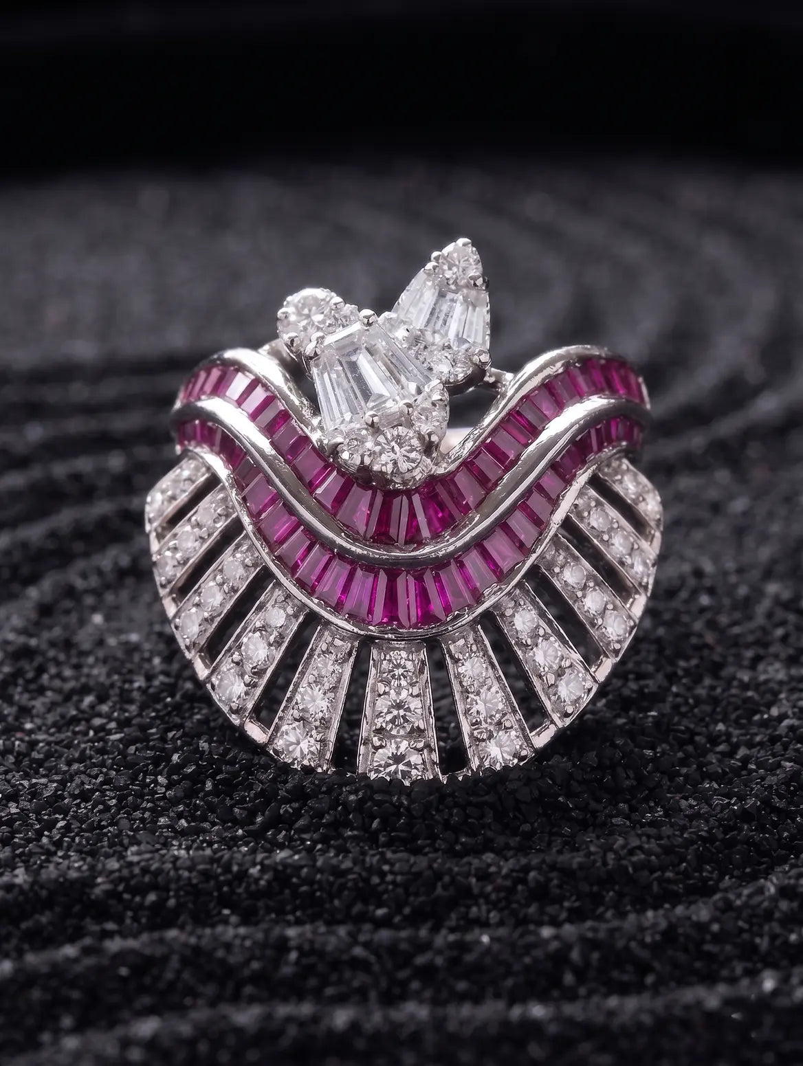 Ruby baguette and diamond detail in sculptural silver jewellery