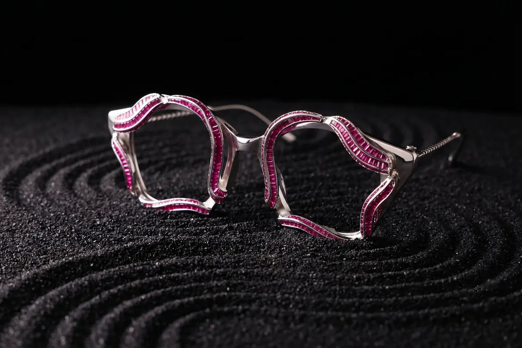 Wave design detail in silver eyewear with red layered tones