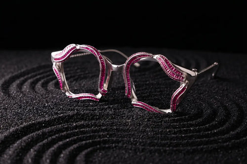 Wave design detail in silver eyewear with red layered tones