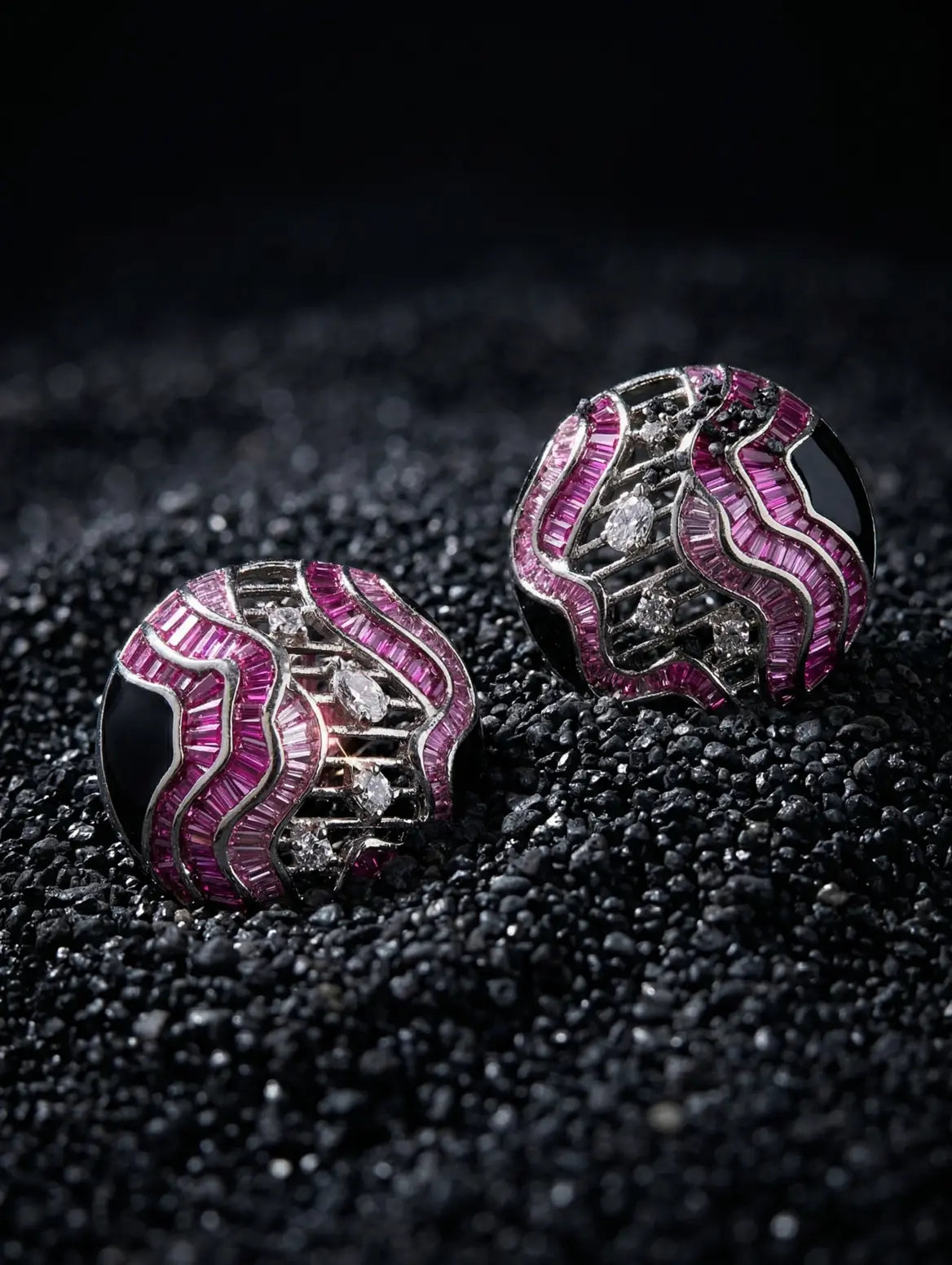 sparkling core detail in sculptural silver earrings wave design