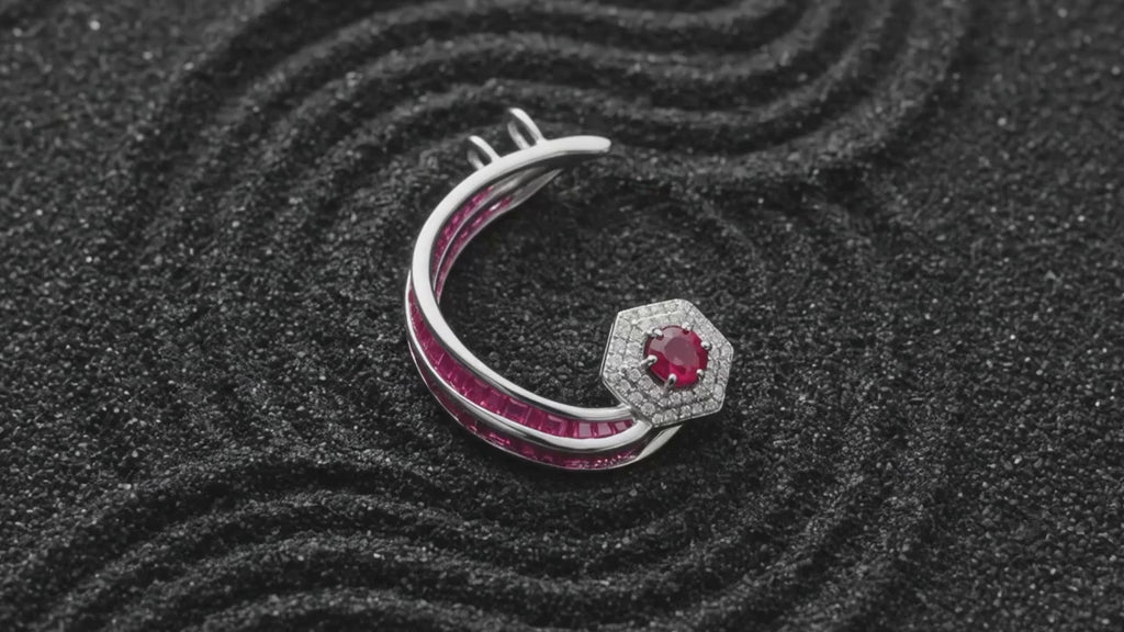Sculptural silver ear cuff with fluid arc design in motion