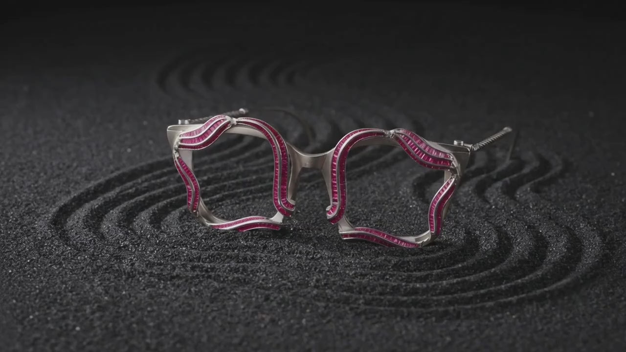 Sculptural silver spectacles in motion