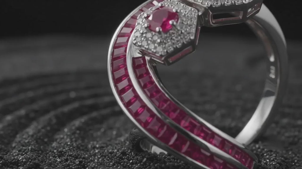 Sculptural silver bloom ring with ruby centerpiece in motion