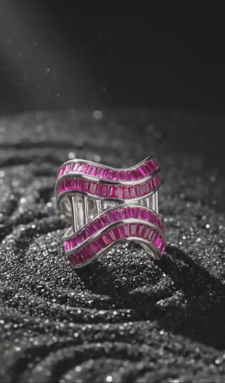 Sculptural silver jewellery with  intertwined wave in motion